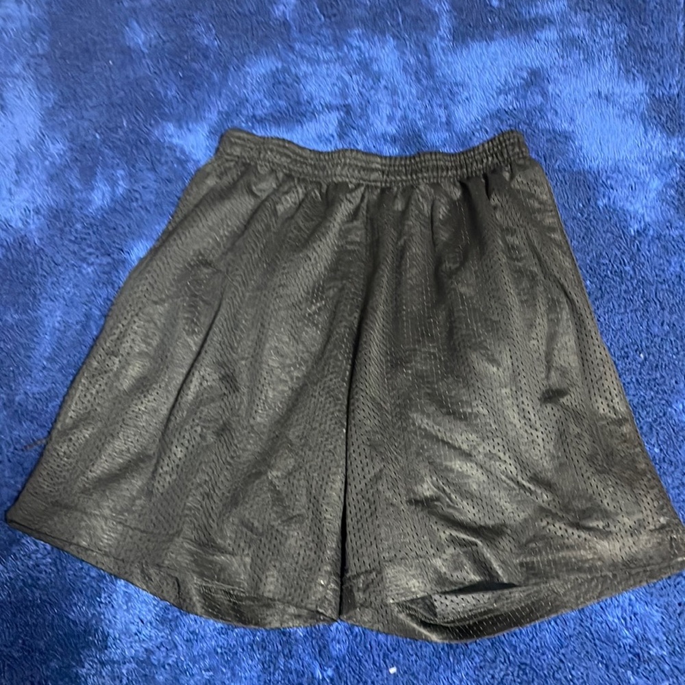 Black athletic shorts with hole in the crotch